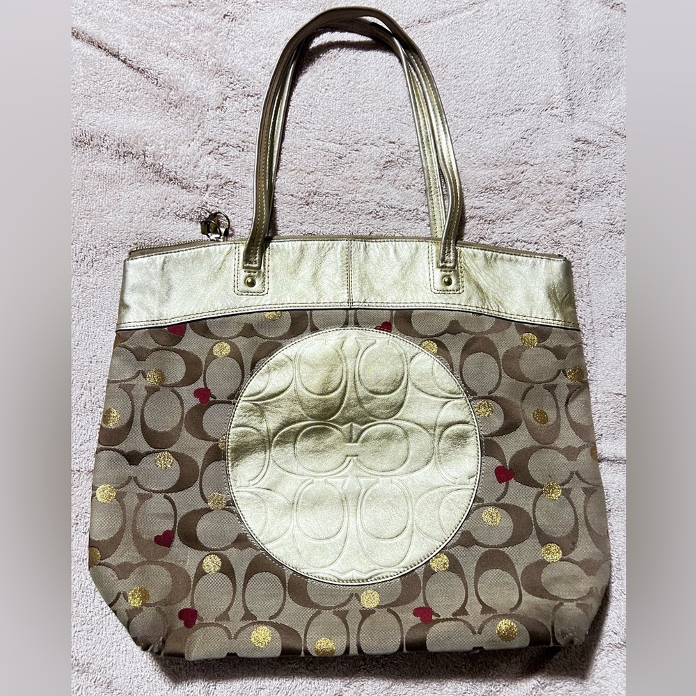 Coach Laura Signature Khaki Secret Admirer Tote in very worn condition.